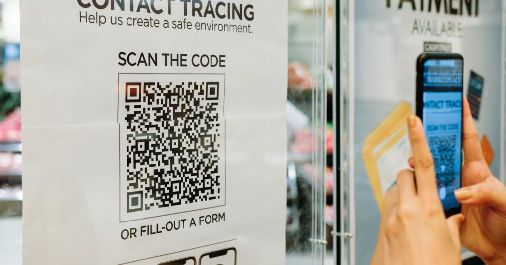 someone scanning a QR code with their phone